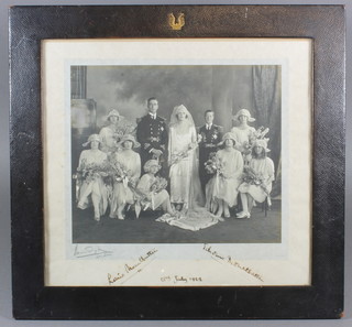 A black and white photograph of Earl Mountbatten's wedding signed Louis Mountbatten and Edwina Mountbatten 18 July  1922, contained in a leather frame with armorial decoration 9" x  9.5"  ILLUSTRATED