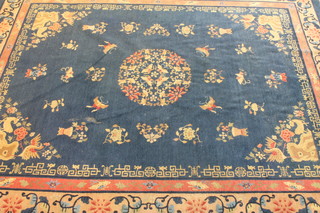 A 1930's blue ground Chinese carpet with central medallion 143" x 145", slight wear