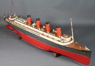 A working model of the RMS Mauritania 114" in length, draft  13", width 13.5", this model is believed to be the working model  used by Cunard in their wet tanks in 1904   ILLUSTRATED