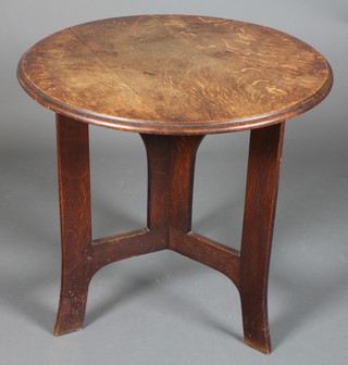 A circular Arts & Crafts oak table raised on a Y shaped arched  support 29"h x 30" diam.