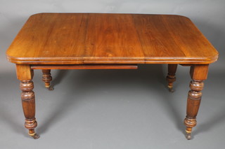 A Victorian mahogany extending dining table with 1 extra leaf raised on turned and reeded supports, complete with winder 29"h x 66"w x 40"d