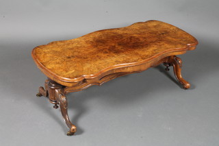 A Victorian figured walnut centre table of serpentine outline, raised on turned supports with H framed stretcher, reduced in  height 15"h x 41"w x 20"d