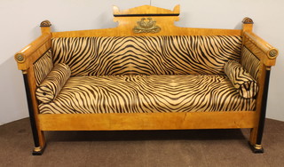 A Biedermeier style settee with raised back upholstered in leathered striped material 37"h x 81"w x 29"d   ILLUSTRATED