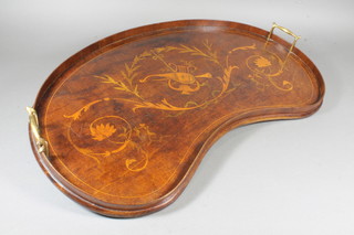 An Edwardian mahogany kidney shaped tea tray with boxwood  and olive wood marquetry decoration, centred with musical  motifs within a laurel reserve 26"w x 17"d