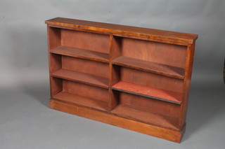 A Victorian mahogany dwarf open bookcase raised on a platform base 33"h x 49"w x 7.5"d