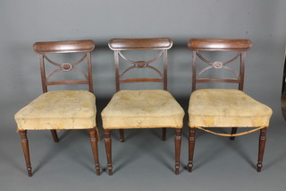 A set of 3 Georgian mahogany bar back dining chairs with X  framed mid rails and upholstered seats, on turned legs