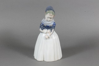 A Royal Copenhagen porcelain figure of a standing bonnetted girl, base marked 1251 7"