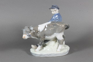 A Royal Copenhagen porcelain figure of a standing bull with herdsman, base marked 772, 7"