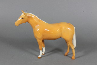 A Beswick figure of a standing Palomino stallion 5.5"