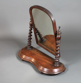 An early Victorian mahogany toilet mirror, the arched top plate with barley twist column supports on a kidney shaped base with  bun feet 32"h x 31"w x 12"d