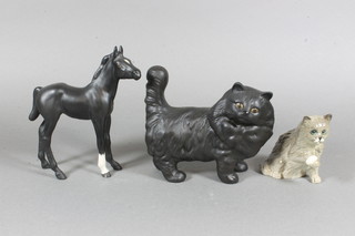 A Royal Doulton figure of a seated cat with bandaged paw 3", a black glazed figure of a standing cat 3", do. figure of a horse 6"