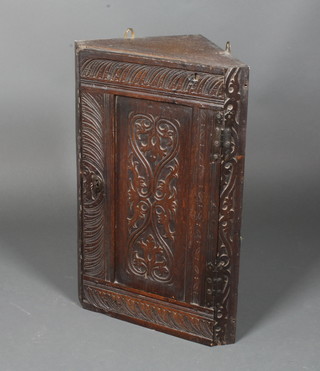 A Victorian carved oak hanging corner cabinet constructed from  old timber 25"h x 16"w x 9.5"d