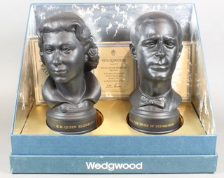 A pair of Wedgwood limited edition black basalt busts of HM Queen and Duke of Edinburgh to commemorate their Silver  Wedding, numbered 19/750, 8"  ILLUSTRATED