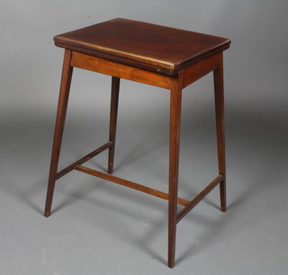 A rectangular Edwardian mahogany card table, raised on square tapering supports united by an H framed stretcher 27"h x 18"w x  14"d