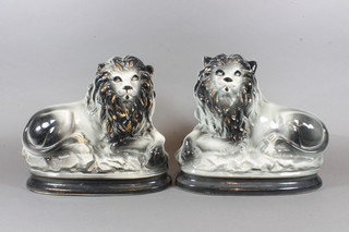 A 19th Century Staffordshire figure of seated lions 9"