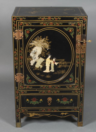A 20th Century Chinese lacquered cabinet having polished  hardstone panels enclosed by a panelled door, the base fitted a  drawer 34"h x 20"w x30d