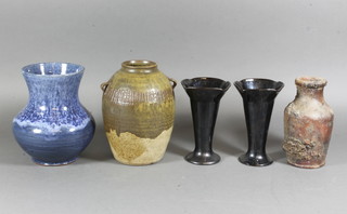 A blue glazed Art Pottery vase 7", a brown Art Pottery vase  marked 7.5", a club shaped encrusted vase containing coins 6"  and 2 pottery vase