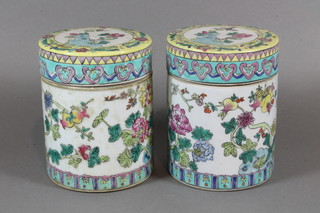A pair of cylindrical Chinese style jars and covers 6"