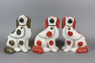 A Staffordshire figure of a seated Spaniel 9.5" and 2  reproduction figures of Spaniels