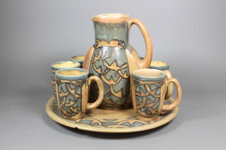 An 8 piece Quimper lemonade set comprising 12" tray - chip to base, jug 8", 6 mugs, the bases marked HB Quimper 7086