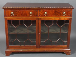 A Victorian Chippendale style mahogany display cabinet fitted 2  long drawers, the base fitted a cupboard enclosed by astragal  glazed panelled doors, raised on bracket feet 36"h x 48"w x 19"d