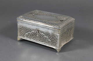 A rectangular pierced Eastern silver box with hinged lid and  fitted interior, 6 ozs