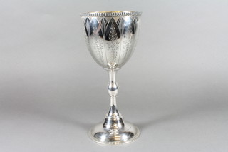 A Victorian engraved silver goblet, raised on a circular spreading foot with parcel gilt interior, makers mark MSAB, 14 ozs