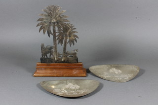 2 Eastern engraved white metal petal shaped dishes 6.5" and a  table ornament in the form of palm trees with mythical beasts