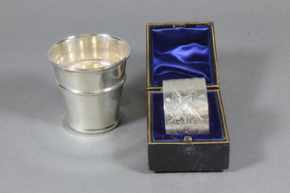 A Victorian silver napkin ring, London 1889, a silver spirit measure Birmingham marks rubbed, 1 ozs