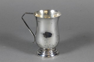 An Art Deco waisted Sterling silver christening tankard 3 ozs