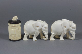 2 carved ivory figures of elephants 2" together with an oval box  and cover 2"