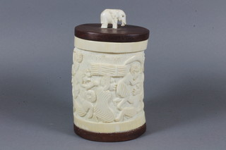 A carved ivory trinket box decorated figures 6"
