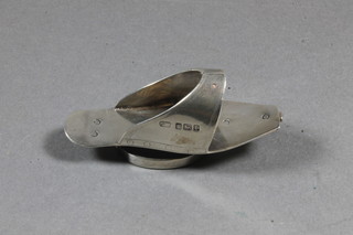 A silver finger pin cushion in the form of a slipper, Sheffield 1909, by George Wish