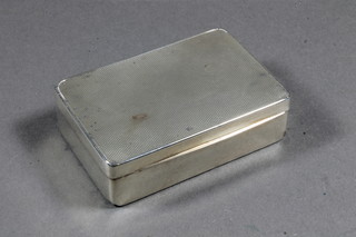 A rectangular silver match box with engine turned decoration - f, London 1930, 2 ozs