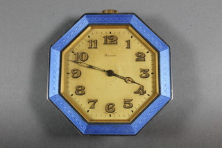 An Art Deco 8 day travelling clock contained in an octagonal  enamelled case
