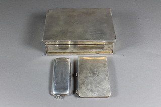 An Edwardian rectangular silver cheroot case 3", Chester 1904, a  silver cased notebook Birmingham 1916 and a rectangular silver  cigarette box Birmingham 1929