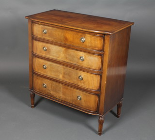 A Georgian style mahogany bow front chest with crossbanded  top, fitted 4 long drawers, raised on turned supports 32"h x 30"w  x 16.5"d