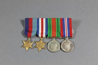 A group of 4 miniature medals comprising 1939-45 Star, France  & Germany Star, Defence & War medal