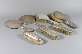 3 silver backed clothes brushes, 2 silver backed hand mirrors and 2 silver backed hair brushes