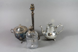 A  cut glass decanter with silver mounts, f, a silver plated twin handled sauce tureen, candlestick and teapot