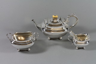 A Georgian style silver plated tea set comprising teapot, twin handled sugar bowl and milk jug complete with tongs