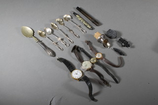 A wristwatch contained in a gold plated case and a collection of curios
