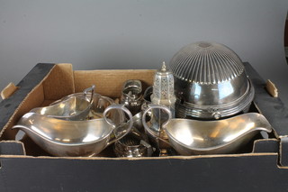 An oval silver plated scroll topped breakfast dish 12", a pair of large silver plated sauce boats and other plated items