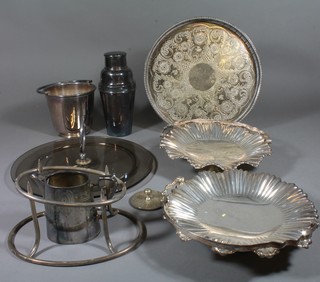 A silver plated cocktail shaker, ditto ice pail, circular tray, pair of cake baskets with swing handles