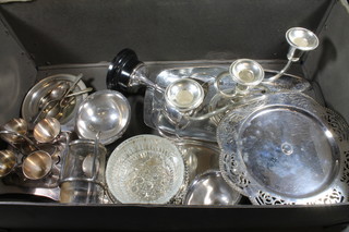 A silver plated 4 piece egg cruet, a silver plated 3 light candelabrum and other plated items etc
