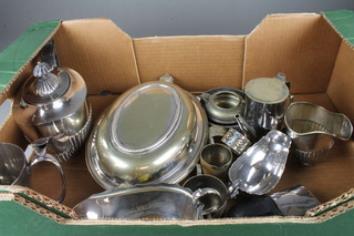 An oval silver plated entrÃ©e dish and cover, an oval Britannia metal teapot and other silver plated items