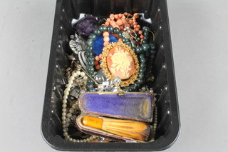 A cigar holder and a collection of costume jewellery