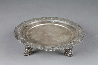 A circular Chinese silver dish with pierced border raised on 3 dragon supports, base marked OCHM, 6 ozs