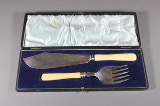 A pair of silver plated fish servers by Walker & Hall