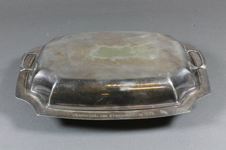 An oval silver plated entree dish and cover 12"